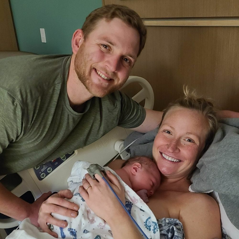 couple holding newborn baby